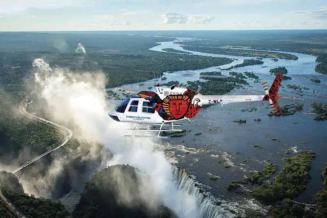 Visit Victoria Falls in Zambia or Zimbabwe: one of the 7 Natural Wonders of the World. Niagara Falls has got nothing on this waterfall.