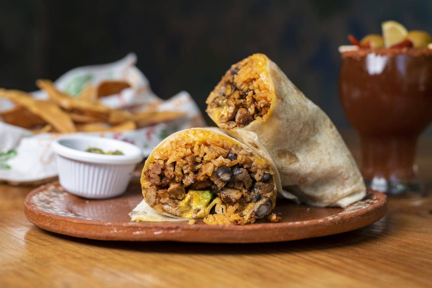 A scrumptious Mexican burrito filled with rice, beans, and beef, perfect for a hearty meal.