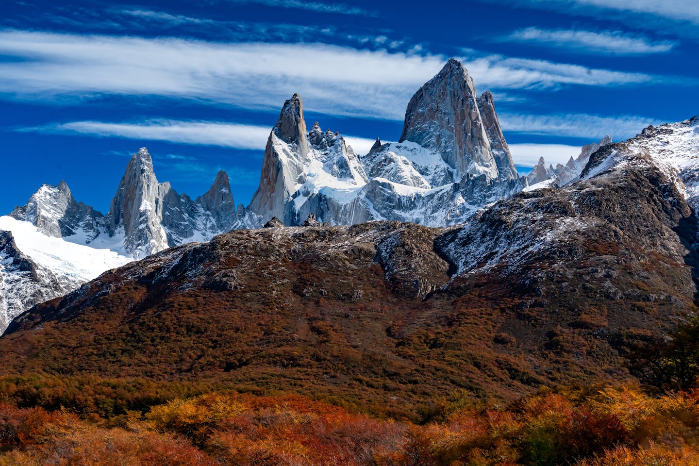 Breathtaking view of Fitz Roy mountains in Patagonia during autumn with vibrant foliage.