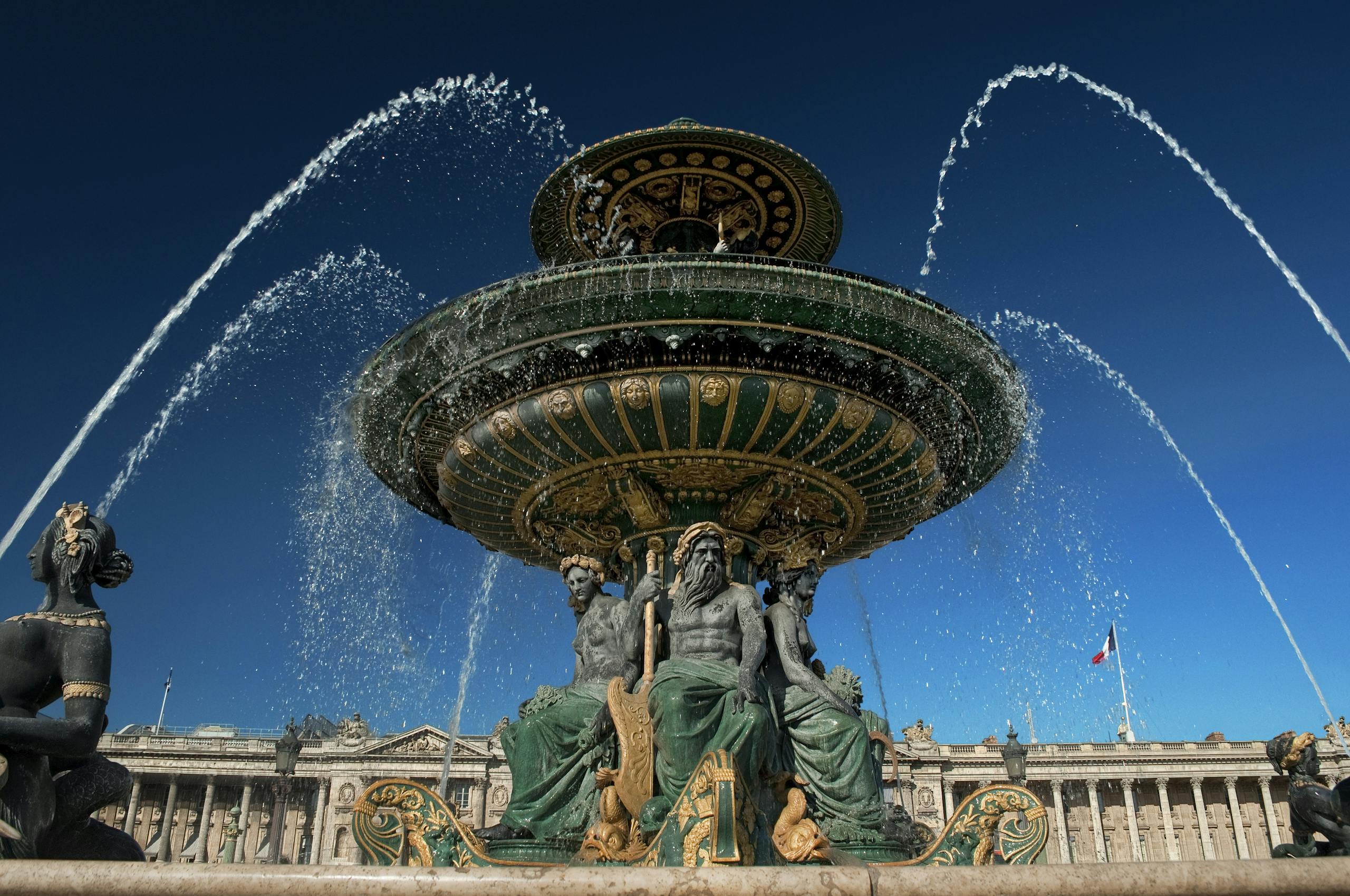 Stunning low angle shot of Fontaine des Mers in Paris on a sunny day.