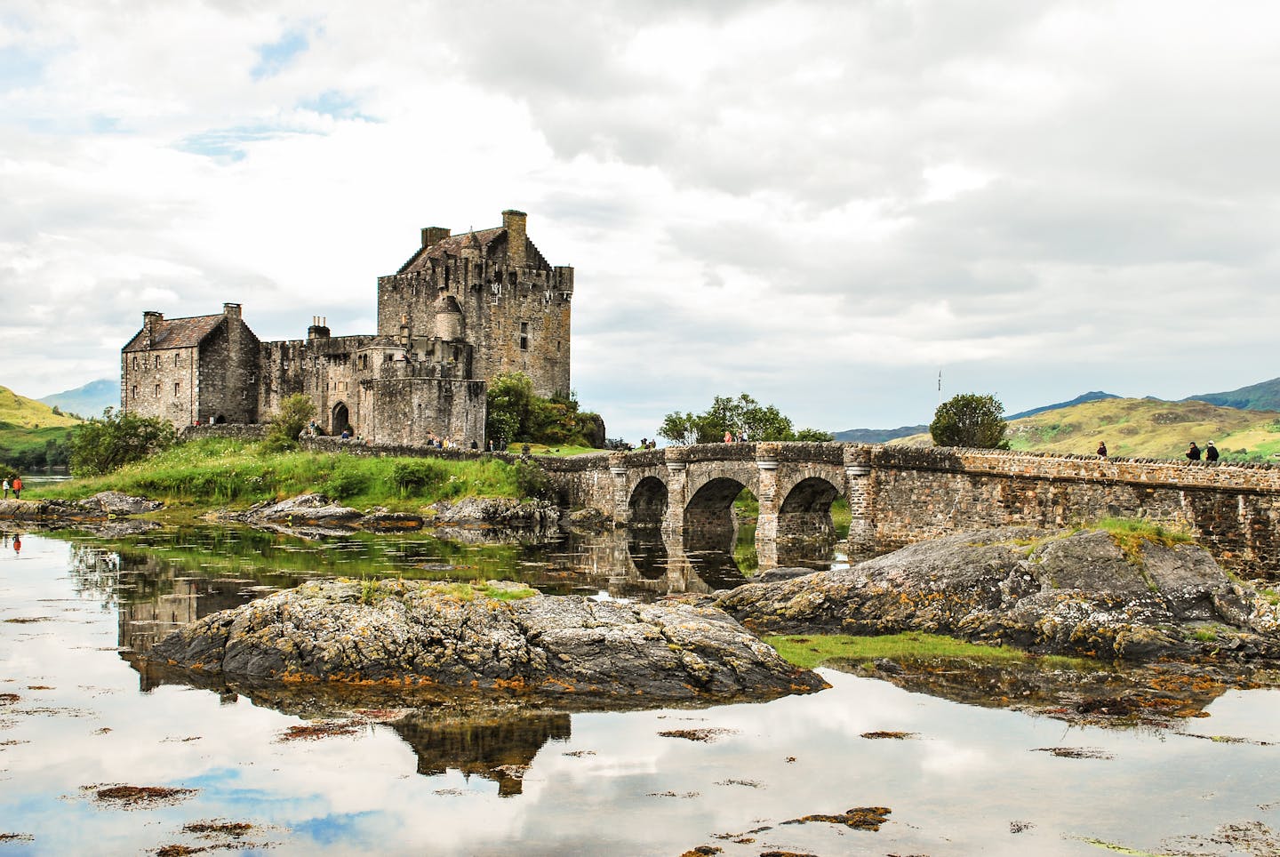 Explore the iconic Eilean Donan Castle and its scenic surroundings in the Scottish Highlands.