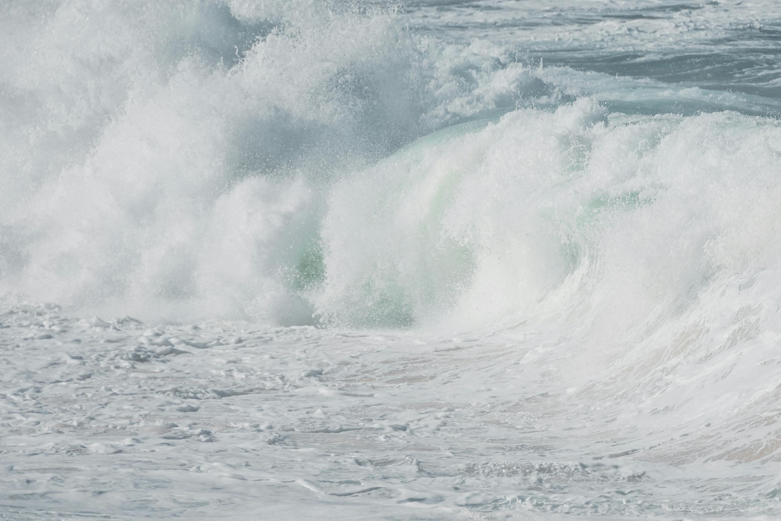 Close-up view of powerful ocean waves crashing and creating a dramatic water splash scene.