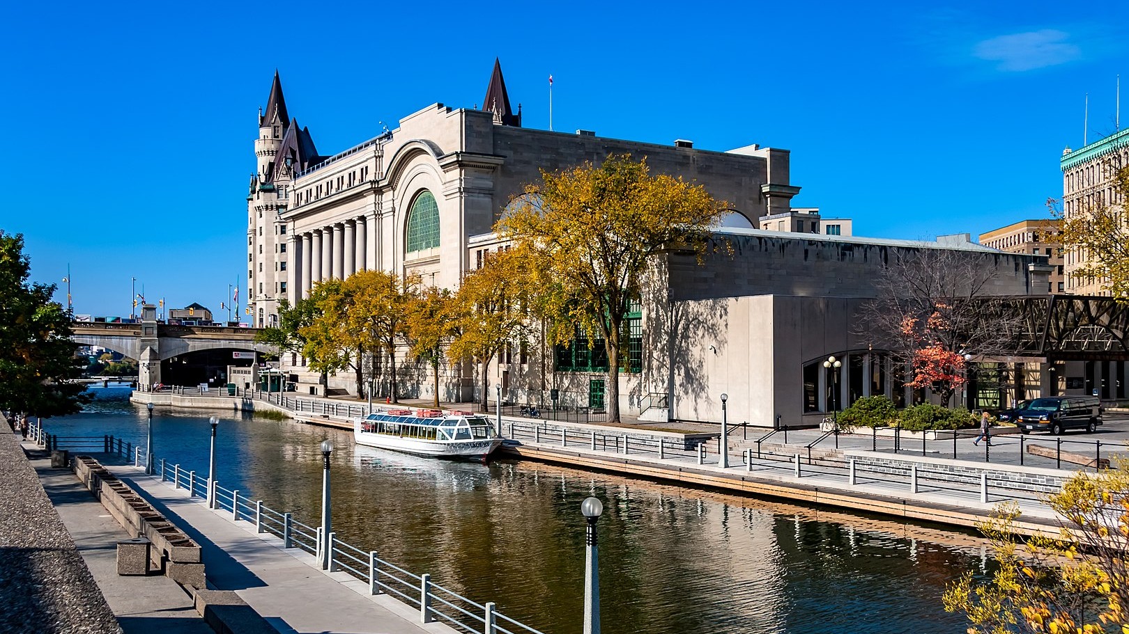 The Rideau Canal, also known unofficially as the Rideau Waterway, connects Canada's capital city of Ottawa, Ontario, to Lake Ontario and the Saint Lawrence River at Kingston, Ontario. It is 202 kilometres in length.[1] The name Rideau, French for "curtain", is derived from the curtain-like appearance of the Rideau River's twin waterfalls where they join the Ottawa River.[2] The canal system uses sections of two rivers, the Rideau and the Cataraqui, as well as several lakes. The Rideau Canal is operated by Parks Canada..https://en.wikipedia.org/wiki/Rideau_Canal