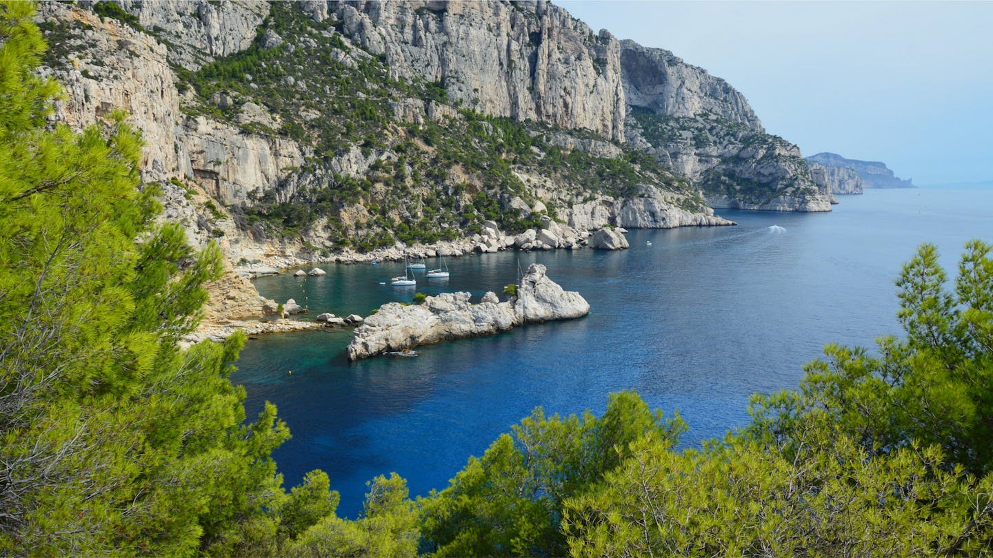 Breathtaking view of the Calanques' rocky cliffs and azure waters in France.