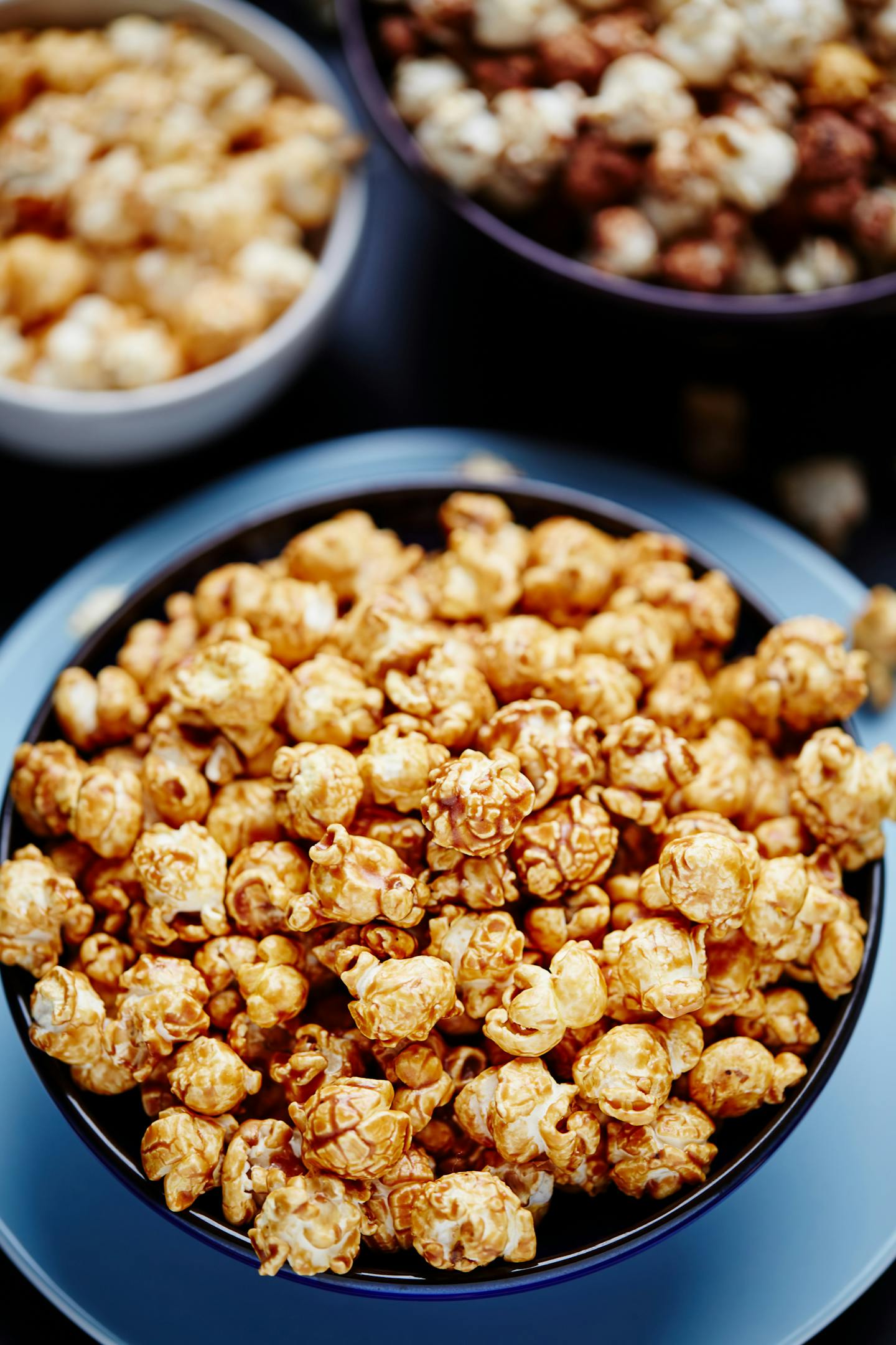 Close-up of caramel-flavored popcorn in a bowl, perfect snack shot.