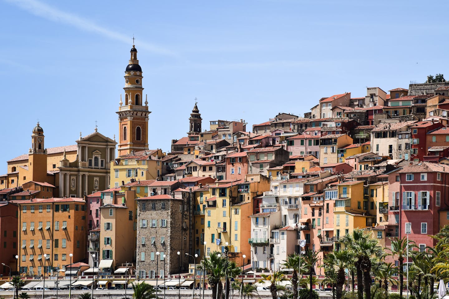 Vibrant hillside buildings in Menton, showcasing iconic French Riviera architecture.