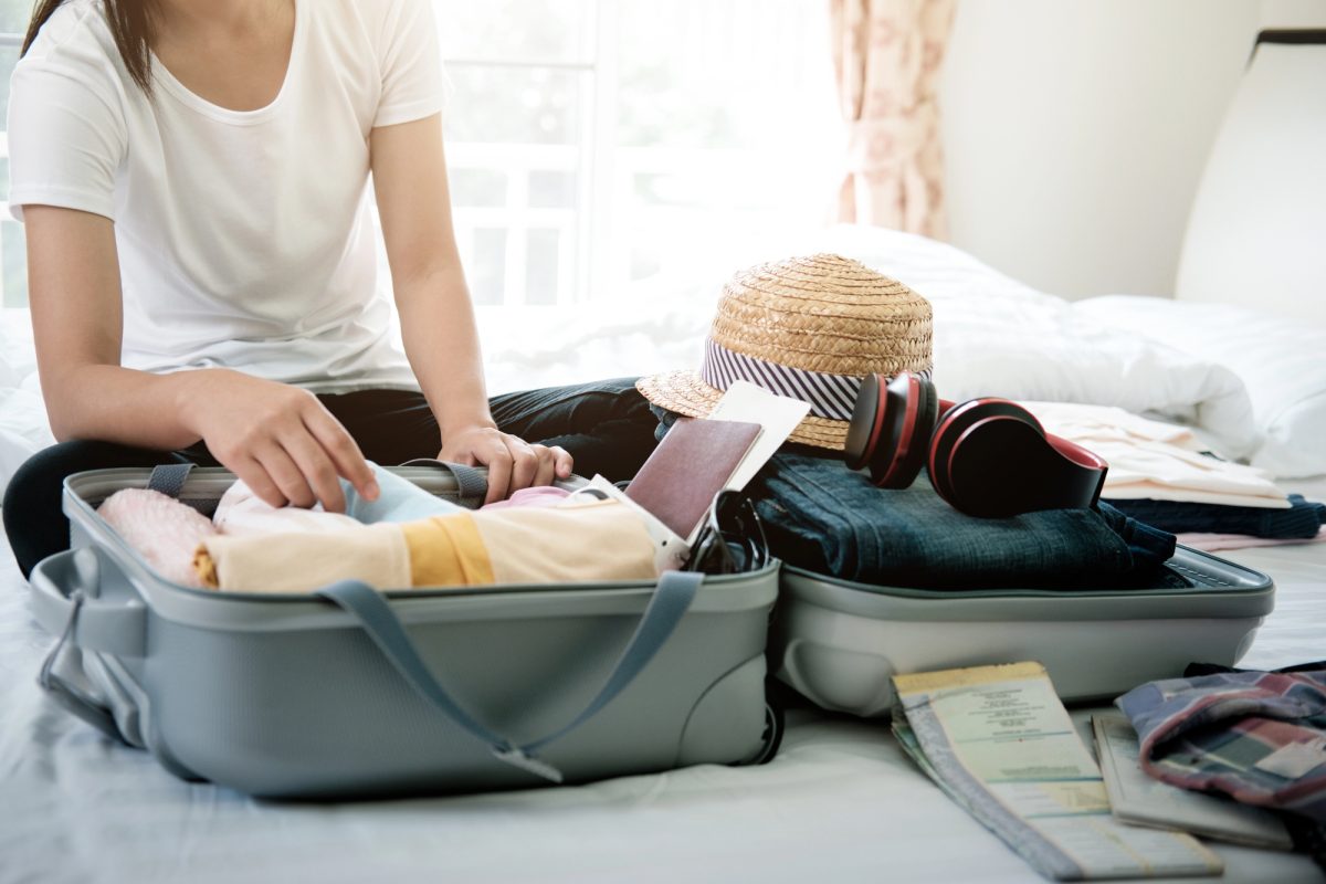 how to roll clothes to pack suitcases