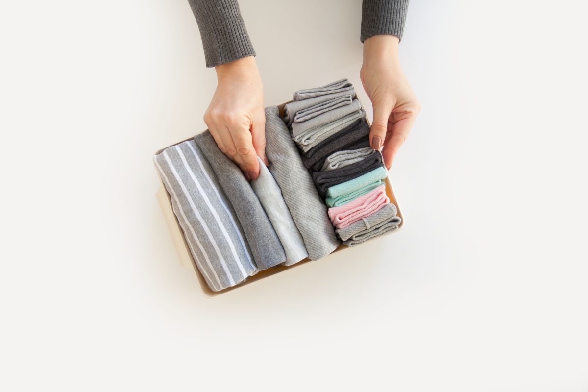 how to roll clothes to pack suitcases