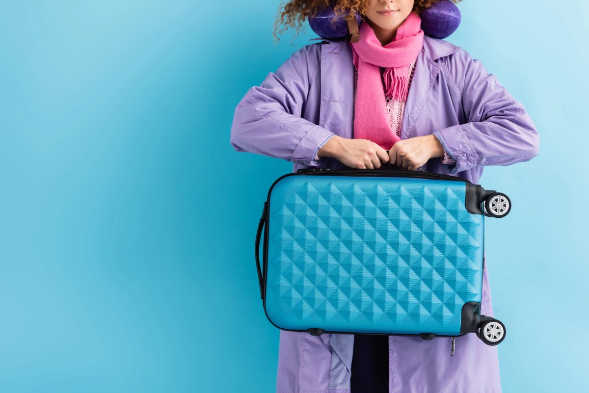 how to roll clothes to pack suitcases