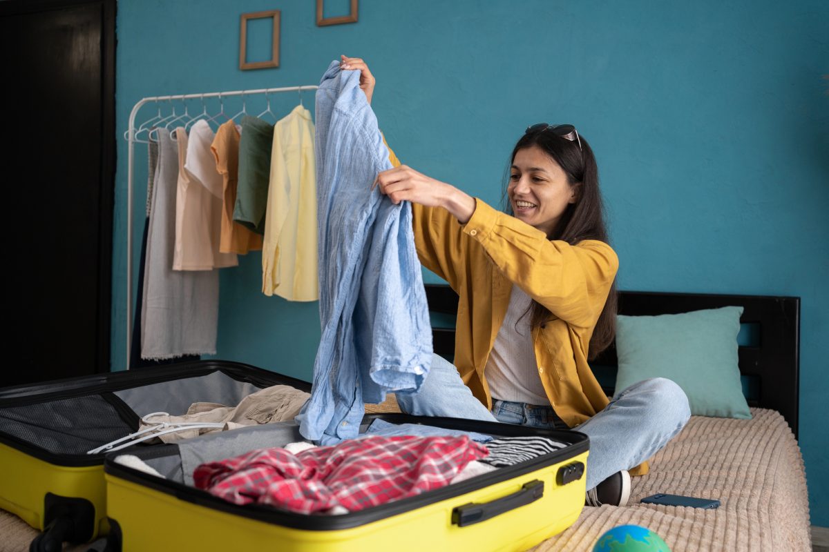 how to roll clothes to pack suitcases