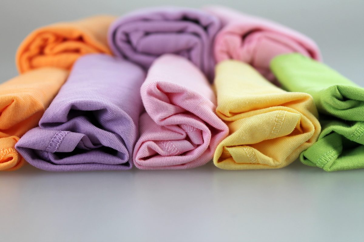 how to roll clothes to pack suitcases